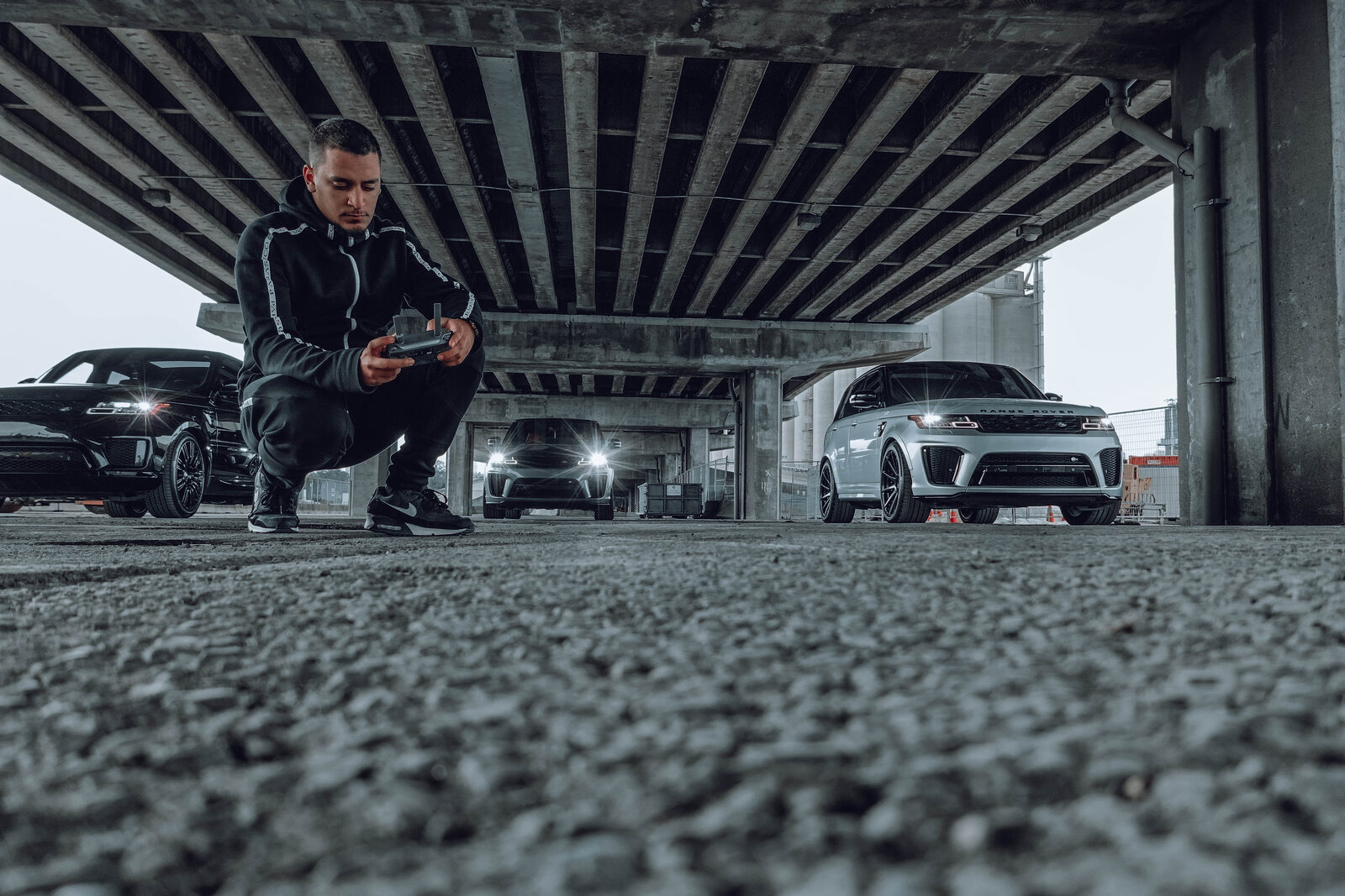 Wolf flying a drone on an automotive shoot