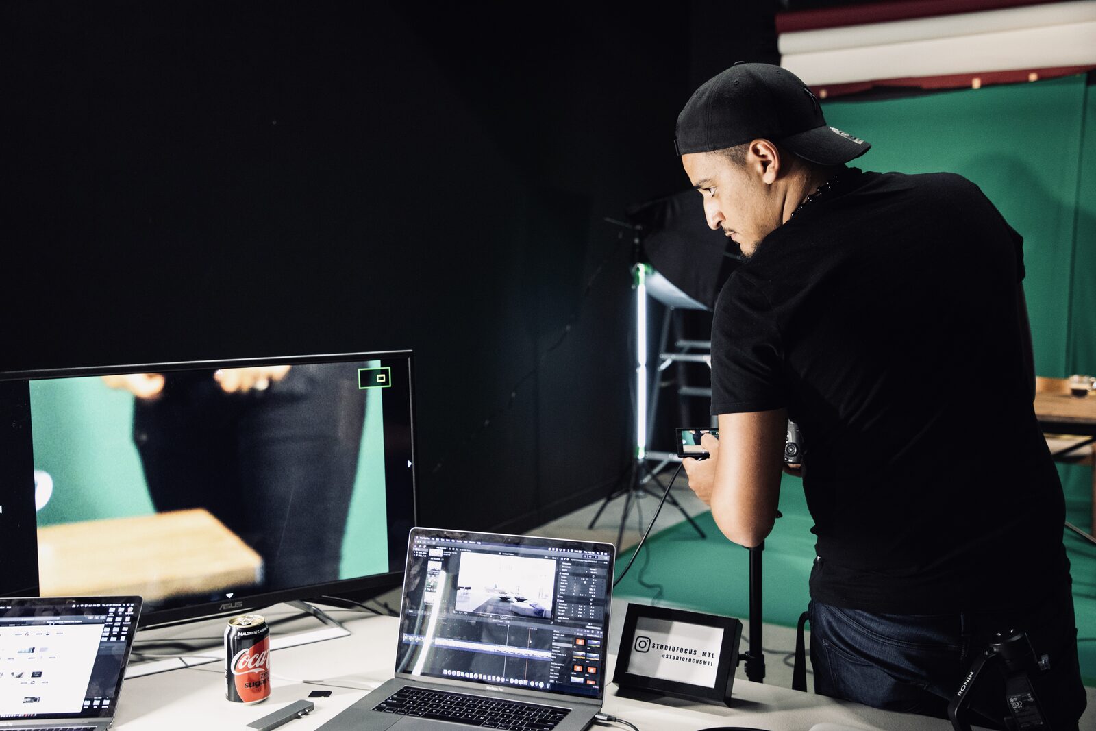 Wolf at his monitor station on a green-screen set