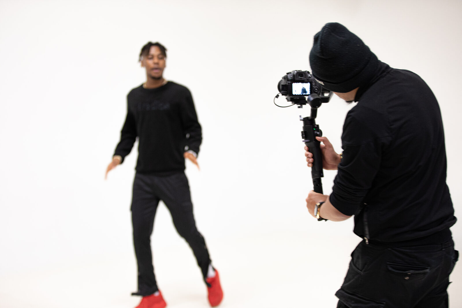 Wolf filming a dancer on the white cyclorama at Focus Studio