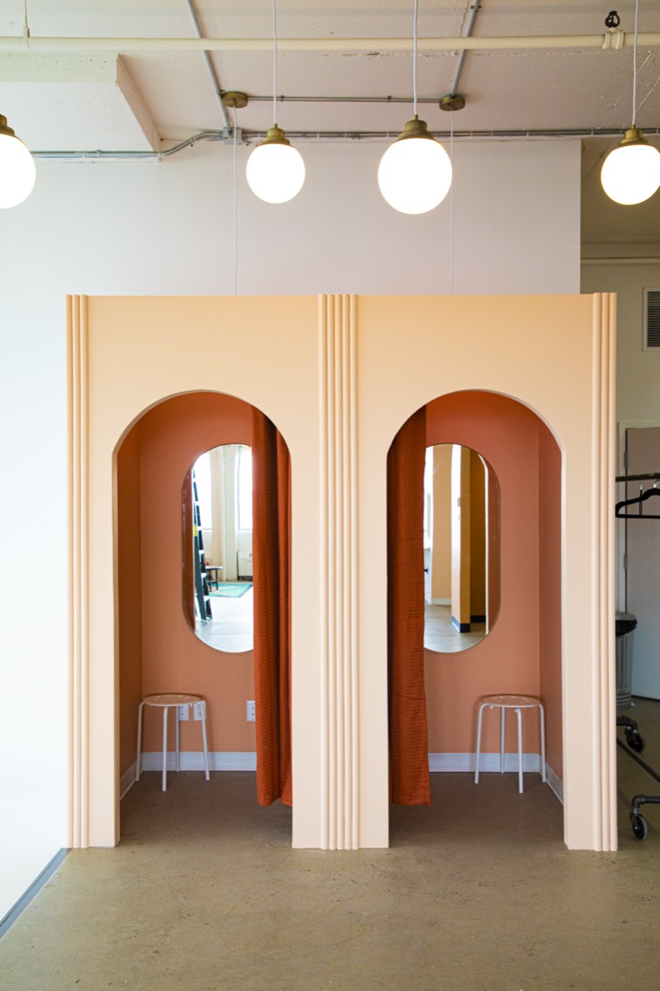 Sunside — fitting booths with arched mirrors